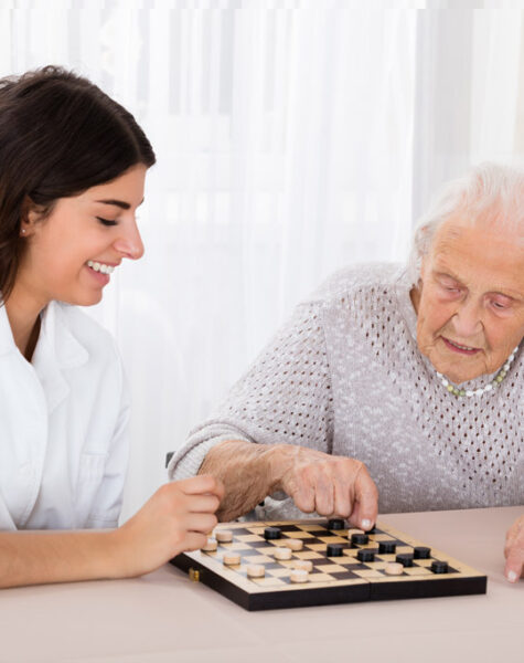 two-women-playing-checkers-game